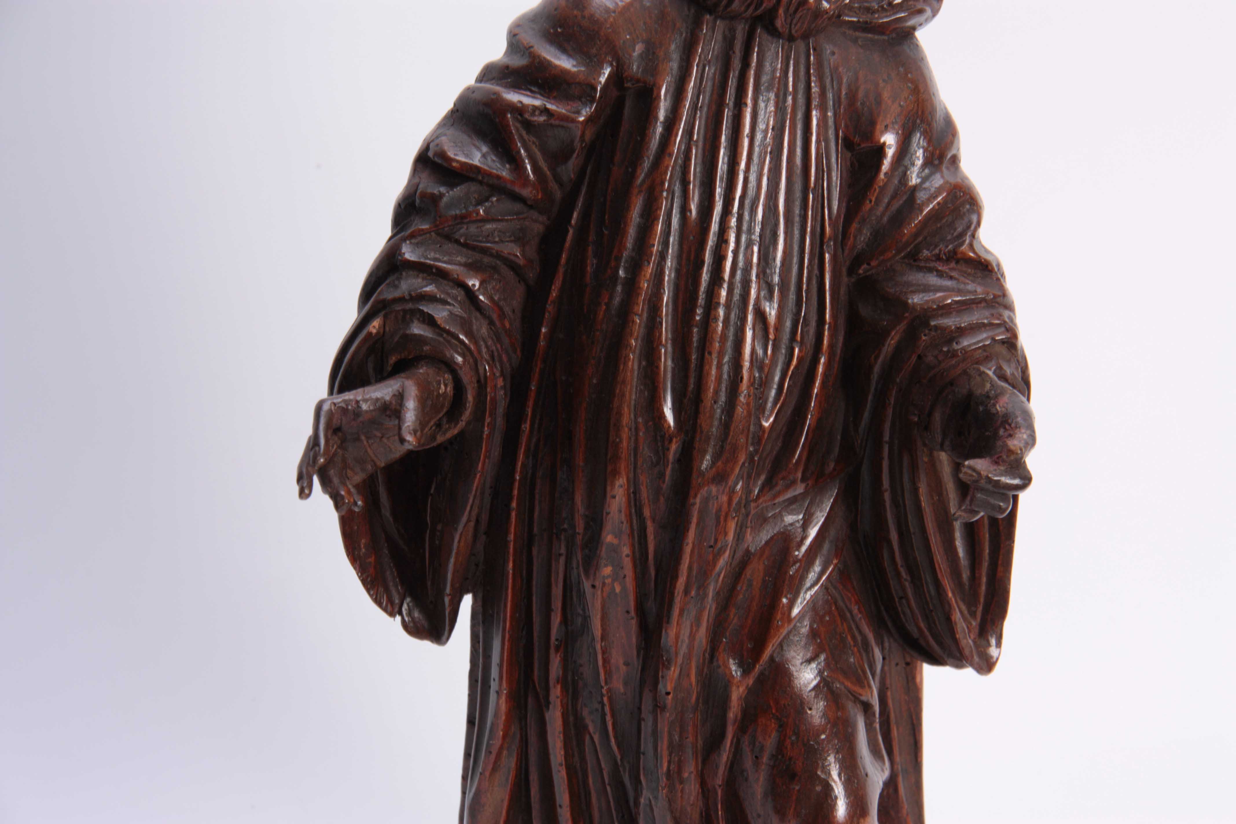 A 17TH CENTURY CARVED LIMEWOOD FIGURE OF A SAINT finely carved with a good patination 48cm high. - Image 3 of 5