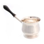 A GEORGE III SILVER BRANDY WARMER of bulbous shape with turned wooden handle, with engraved