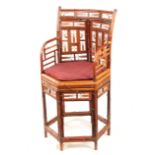 A 19TH CENTURY BRIGHTON PAVILION HEXAGON SHAPED BAMBOO ARMCHAIR with stylised panelled back and cane