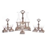 A 19TH CENTURY FRENCH HALLMARKED SILVER TABLE SET in the rococo taste having cut glass bottles