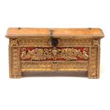 AN 18TH CENTURY ITALIAN CARVED GILTWOOD COFFER with baroque style carved front, above an iron