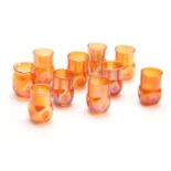A SET OF TEN TIFFANY FAVRILE SHOT GLASSES with square dimple bodies and plain necks 5cm high -