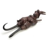 A LARGE LATE 19th CENTURY MUSICAL CARVED BLACK FOREST COAT HOOK modelled as a well-dressed fox