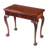 A MID 18TH CENTURY IRISH MAHOGANY FOLD OVER CARD TABLE the green baize lined playing surface with