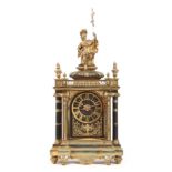 A LARGE LATE 19th CENTURY FRENCH ORMOLU AND EBONISED MANTEL CLOCK the case surmounted by a seated