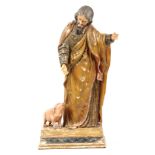 A 19TH CENTURY CARVED WOOD POLYCHROME FIGURE OF SAINT ANTHONY on a rectangular plinth base 92cm high