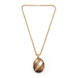 A VICTORIAN LARGE OVAL LOCKET AND NECK CHAIN - tested as 15ct Gold, the front with diagonal