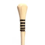 A 19th CENTURY IVORY AND BALEEN BANDED WALKING CANE of segmented form with a carved handle on a