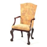 AN UNUSUAL GEORGE II MAHOGANY ARMCHAIR with angled shaped back and sweeping open arms; standing on