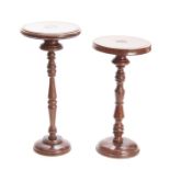 TWO 19TH CENTURY WALNUT WIGSTANDS having ringed tops above turned column supports standing on