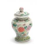 A CHINESE FAMILLE VERTE BULBOUS SHAPED LIDDED VASE decorated with flower sprays 17.5cm high.