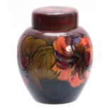 A WALTER MOORCROFT LARGE BULBOUS GINGER JAR AND COVER with colourful tube lined decoration of