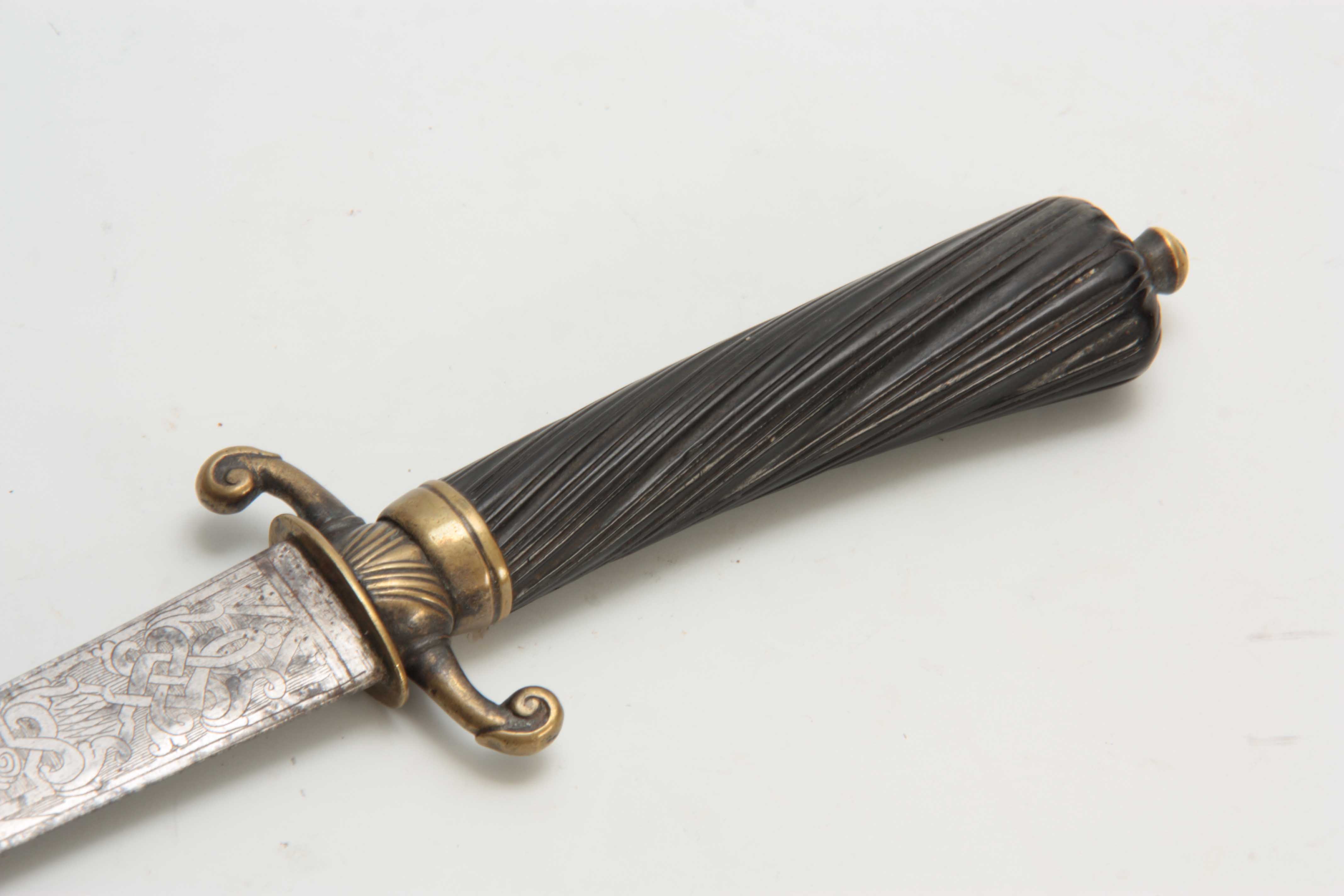 A MID 18th CENTURY FRENCH HANGER SWORD having a twisted fluted ebony grip with brass quillon on a - Image 3 of 3