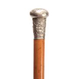 A LATE 19th CENTURY ORIENTAL SILVER HANDLED MALACCA WALKING CANE the handle embossed with figures in