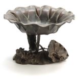 A MEIJI PERIOD JAPANESE PATINATED GREEN BRONZE PEDESTAL BOWL modelled as a large lily pad with