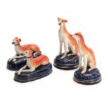 TWO PAIRS OF LATE 19TH CENTURY STAFFORDSHIRE HOUNDS 9cm wide 6.5cm high and 6cm wide 11cm high.