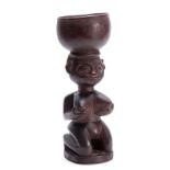 AN AFRICAN TRIBAL CARVED HARDWOOD GOBLET depicting a nude lady 28cm high.