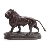 A LATE 19TH CENTURY BRONZE SCULPTURE OF A LION mounted on a naturalistic base 30cm wide 21.5cm