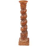 A 19TH CENTURY CARVED OAK BARLEY TWIST COLUMN with ivy vines and floral carved base 113cm high.