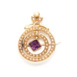 A YELLOW GOLD SET SEED PEARL DOUBLE RING BROOCH with spray cresting and lozenge-shaped Amethyst