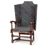 A HIGHLY UNUSUALLY WALNUT CHARLES II RECLINING WING ARMCHAIR with hinged upholstered back and seat