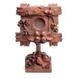 A 19TH CENTURY SWISS CARVED BLACK FOREST POCKET WATCH HOLDER decorated with a cross-hatched frame