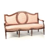 AN 18TH CENTURY WALNUT ITALIAN THREE SEATER SETTEE OF SHAPED SERPENTINE FORM having a panelled