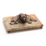 OF RUSSIAN INTEREST, A 19TH CENTURY GILT BRONZE INKWELL OF A FOLDED BEAR RUG mounted on an onyx