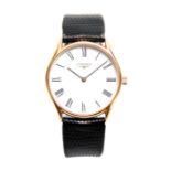 A GENTLEMANS GOLDPLATED LONGINES WRIST WATCH on snakeskin leather strap, the goldplated case with
