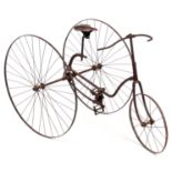 AN UNUSUAL 19th CENTURY CHILDS TRICYCLE having an iron frame and spoked wheels with chain drive