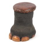 AN EARLY 20th CENTURY TAXIDERMY STOOL formed from an elephants foot 41cm high