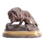 A 19TH CENTURY BRONZE SCULPTURE depicting a Lion and a Serpent mounted on a gilt brass moulded and