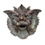 A 19TH CENTURY BRONZE FOUNTAIN MASK 28cm wide 23cm high.