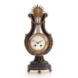 A LATE 19th CENTURY FRENCH ORMOLU MOUNTED MYSTERY CLOCK the lyre-shaped cobalt blue porcelain case