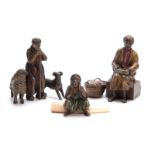 A COLLECTION OF THREE EARLY 20th CENTURY COLD PAINTED BRONZE FIGURES modelled as an Arab bookseller,