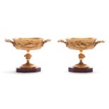 A PAIR OF ORMOLU MOUNTED DISHES ON MARBLE BASES, 17.5cm wide, 12.5cm high.