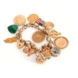 A 9CT GOLD CHARM BRACELET with thirteen 9ct gold charms, one malachite charm, and one silver and