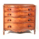 A GEORGE III MAHOGANY SERPENTINE CHEST OF DRAWERS having four long graduated drawers fitted with
