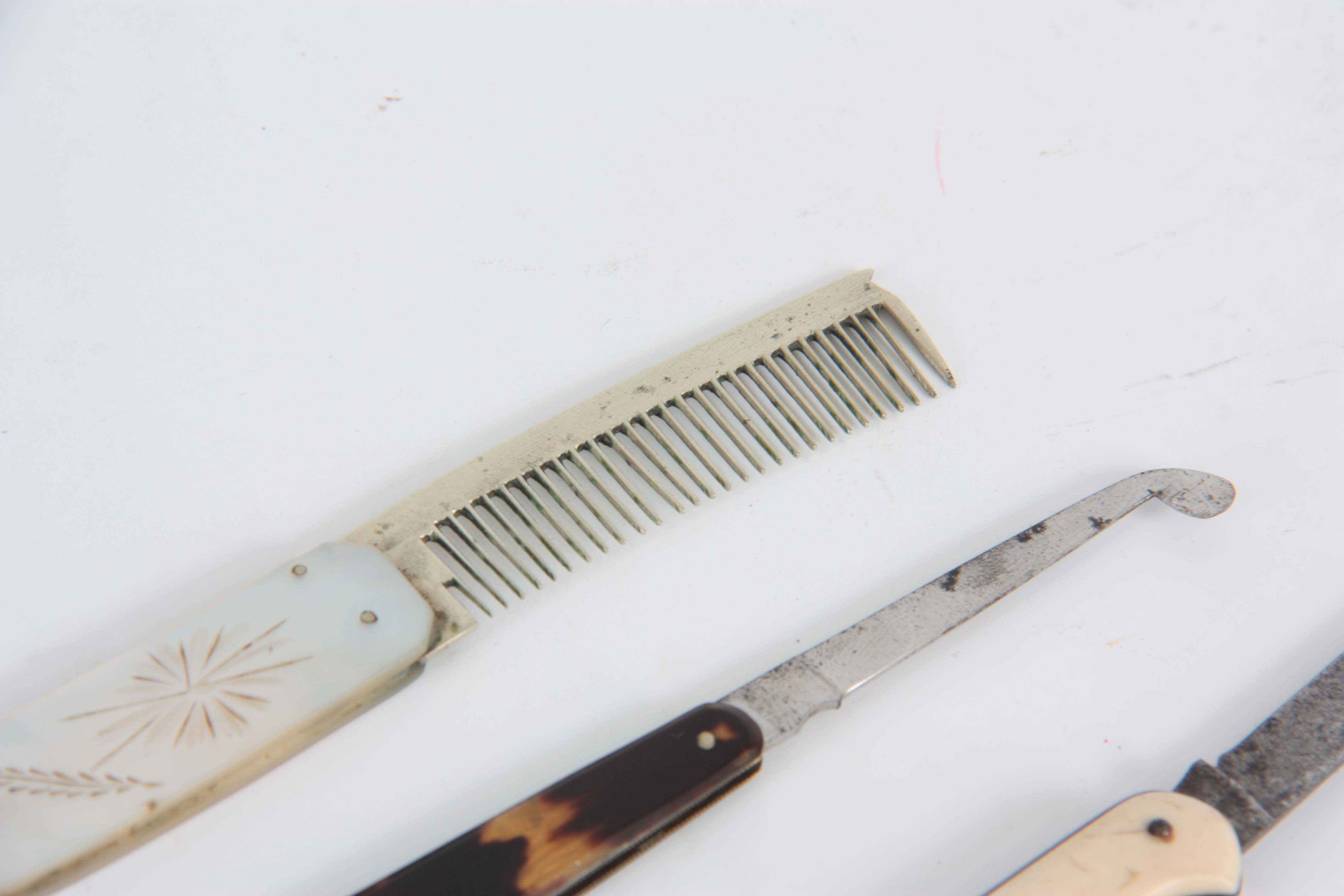 A 19TH CENTURY COMB with engraved mother of pearl handle and silver comb, TOGETHER WITH A SURGEONS - Image 2 of 4
