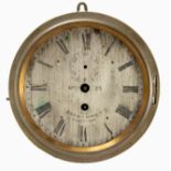 A LATE 19th CENTURY BRASS BULKHEAD CLOCK the drum style case enclosing a 7” silvered engraved dial