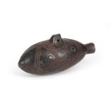 A CARVED AFRICAN HARDWOOD SNUFF BOTTLE with suspension hole and carved, patterned decoration 6cm