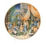 A 17TH CENTURY ITALIAN MAJOLICA POLYCHROME SHALLOW DISH with all over painted decoration of young