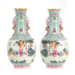A PAIR OF CHINESE REPUBLIC LATE 19TH CENTURY FAMILLE ROSE VASES decorated with continuous garden