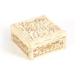 A 19TH CENTURY CHINESE CANTON CARVED IVORY LIDDED BOX finely decorated with figures seated under