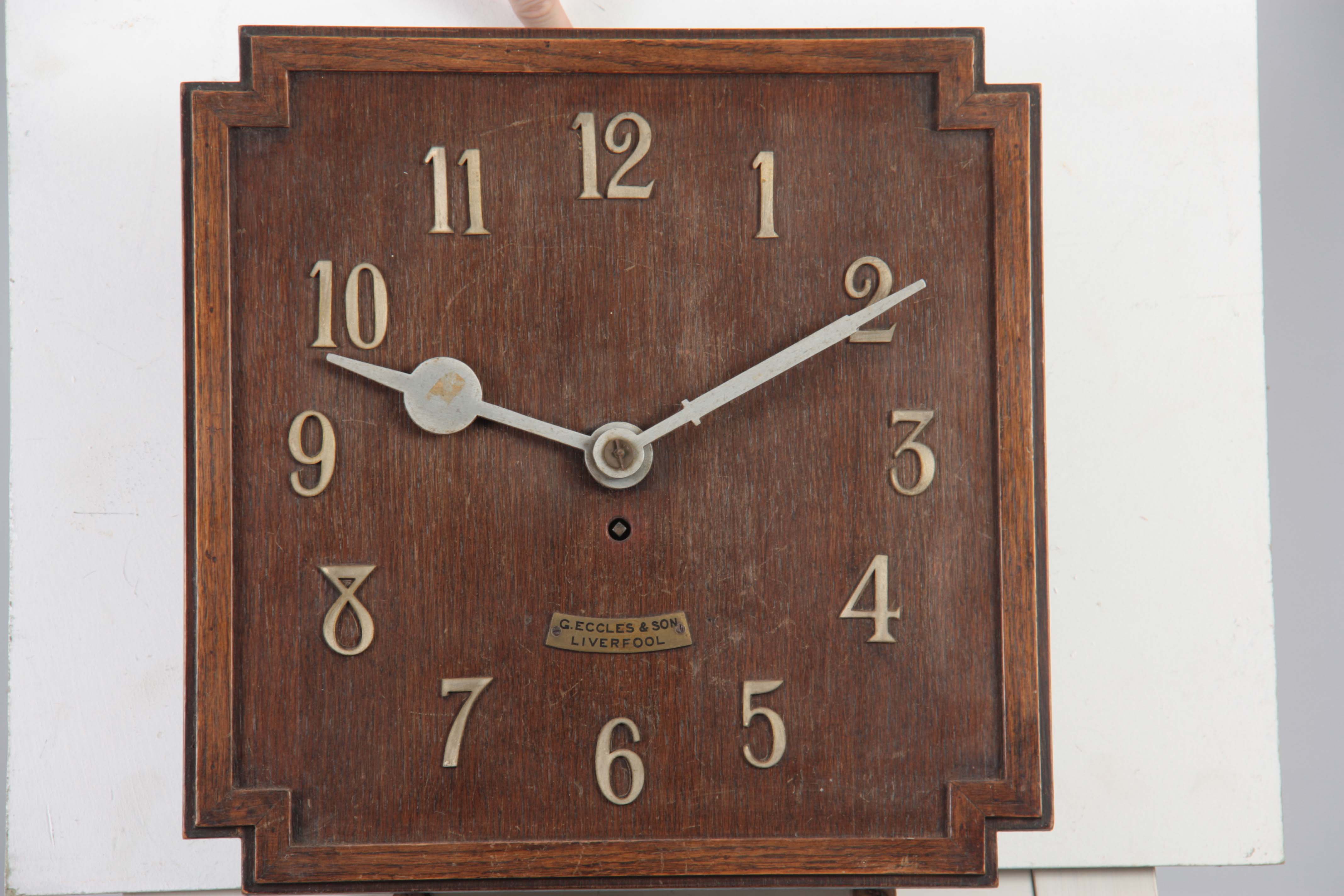 G. ECCLES & SON, LIVERPOOL. AN OAK ART DECO FUSEE WALL CLOCK the 38cm squared dial with applied - Image 2 of 10