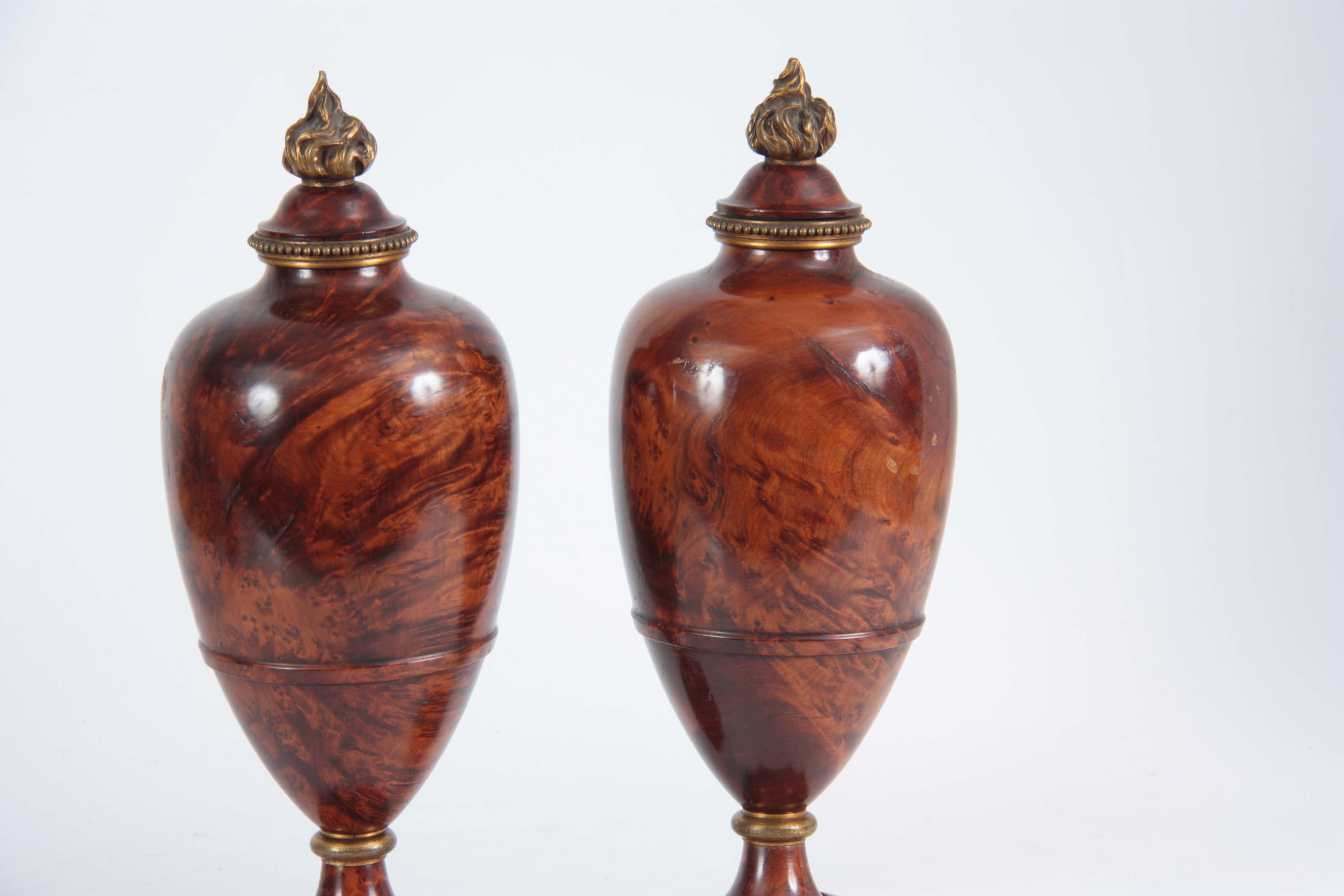 A FINE PAIR OF 19TH CENTURY BURR YEW-WOOD ORMOLU MOUNTED URNS with flame finials and bulbous - Image 4 of 4