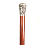 A LATE 19th CENTURY MALACCA AND INDIAN SILVER METAL WALKING CANE the relief work handle depicting