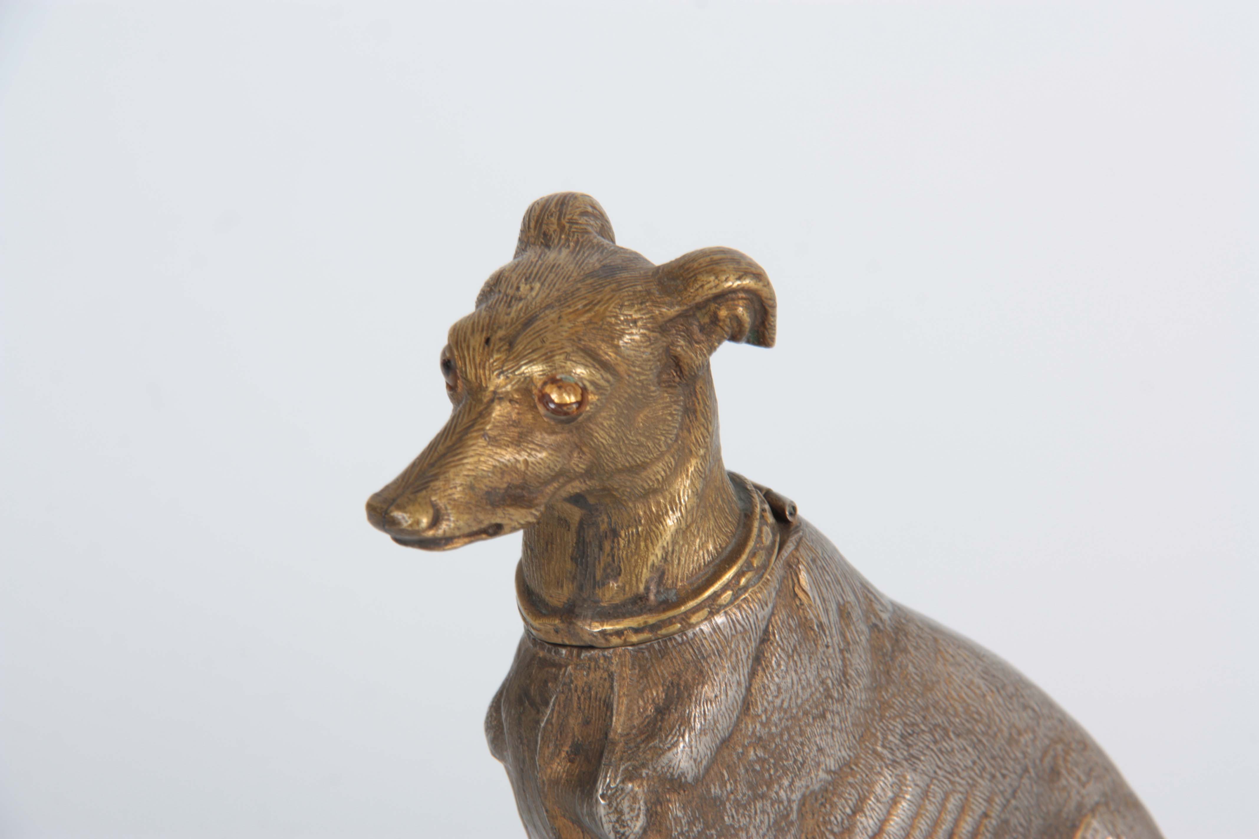 A LATE 19th CENTURY NOVELTY INKWELL modelled as a gilt metal greyhound with amber glass eyes - Image 2 of 4