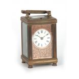 A LATE 19th CENTURY FRENCH REPEATING CARRIAGE CLOCK the brass case with reeded corners enclosing a