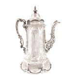 A MID 19th CENTURY SILVER COFFEE POT having a domed hinged lid with a fluted engraved body and